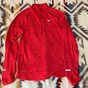 Like new Nike Thermal 1/4 zip in a reddish/orange color.